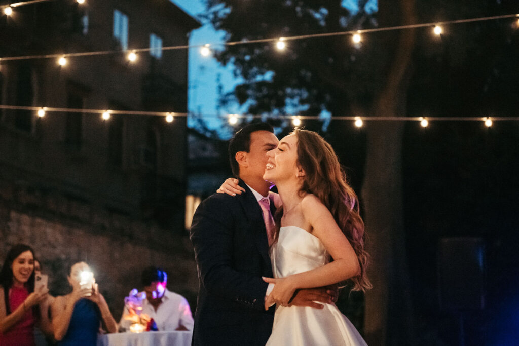 The bride and groom share a tender moment on the dance floor, their graceful movements capturing the magic of their first dance as a married couple