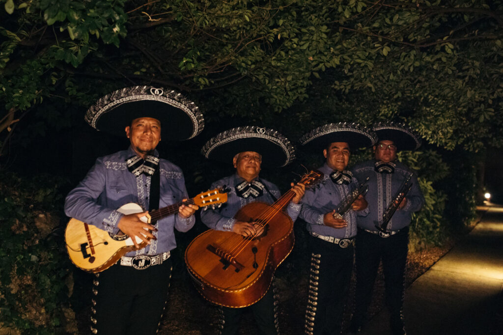 The Mariachi band stands ready to enter, adding a touch of excitement and cultural richness to the celebration with their vibrant music