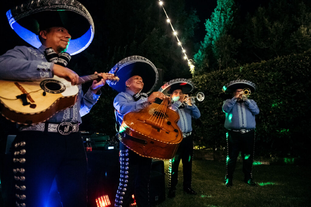 The talented mariachi play vibrant tunes, infusing the celebration with lively and culturally rich melodies, creating an unforgettable musical atmosphere at this italo-mexican party