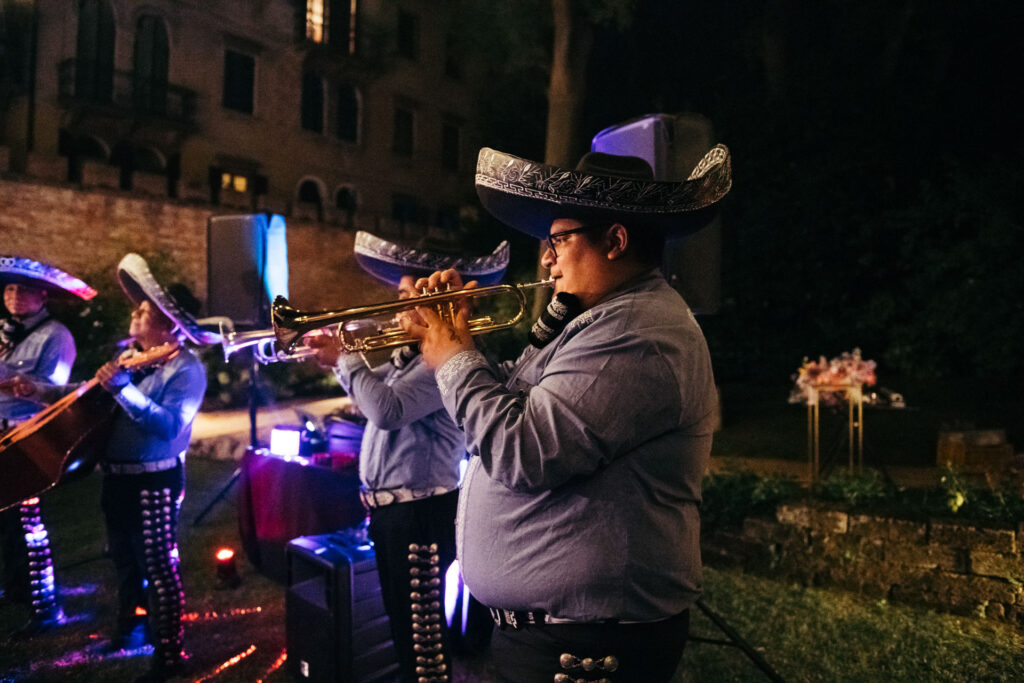 The talented mariachi play vibrant tunes, infusing the celebration with lively and culturally rich melodies, creating an unforgettable musical atmosphere at this italo-mexican party