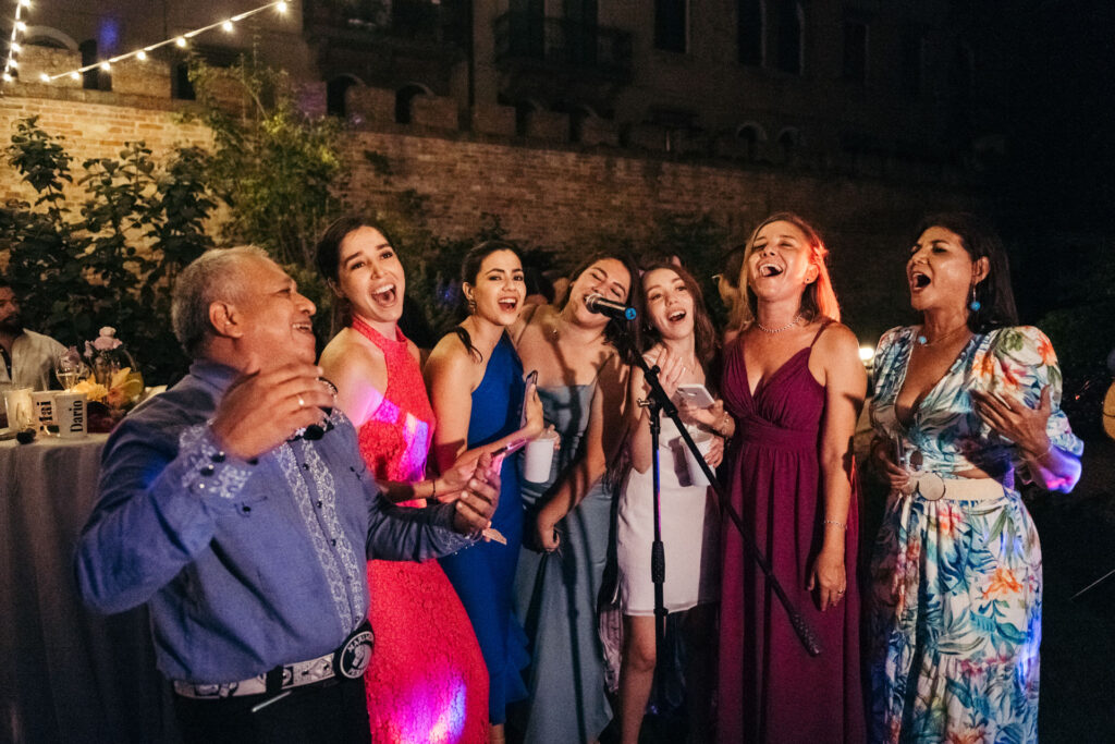 The Mariachi band serenades with heartfelt melodies, creating a magical and culturally rich ambiance with their expressive singing during the celebration