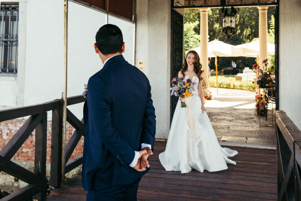 Emotional first look photos document the intimate and genuine reactions of the bride and groom as they see each other for the first time on their wedding day, creating timeless memories