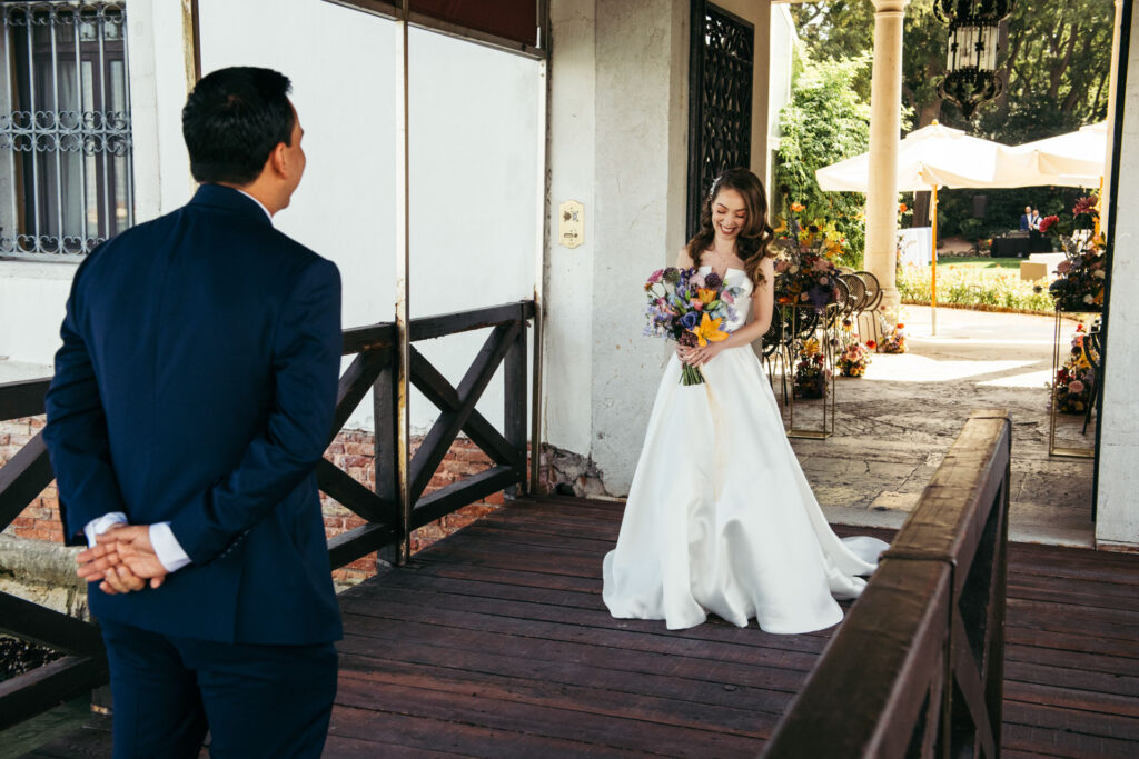 Emotional first look photos document the intimate and genuine reactions of the bride and groom as they see each other for the first time on their wedding day, creating timeless memories