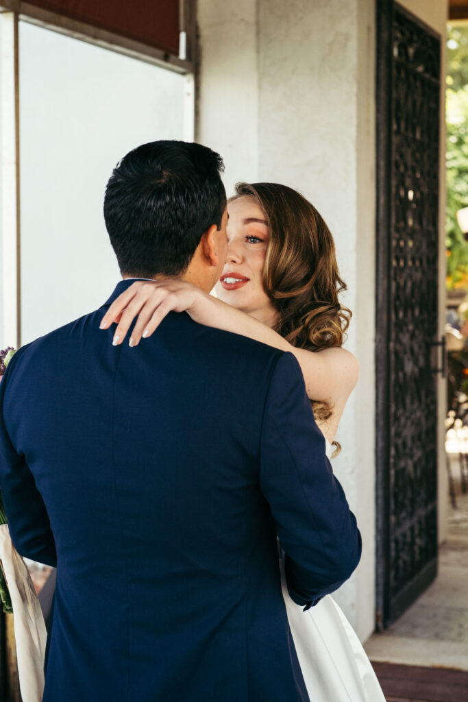 Emotional first look photos document the intimate and genuine reactions of the bride and groom as they see each other for the first time on their wedding day, creating timeless memories