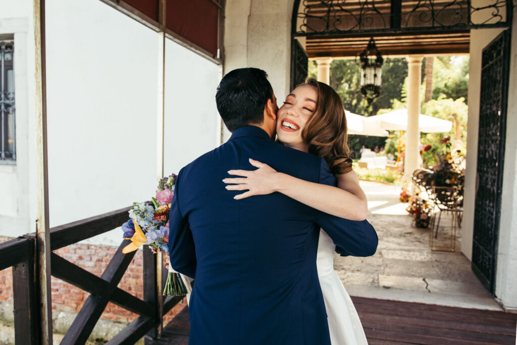 Emotional first look photos document the intimate and genuine reactions of the bride and groom as they see each other for the first time on their wedding day, creating timeless memories