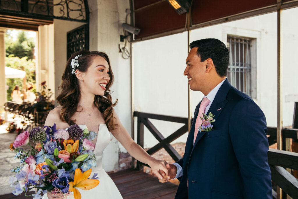 Emotional first look photos document the intimate and genuine reactions of the bride and groom as they see each other for the first time on their wedding day, creating timeless memories