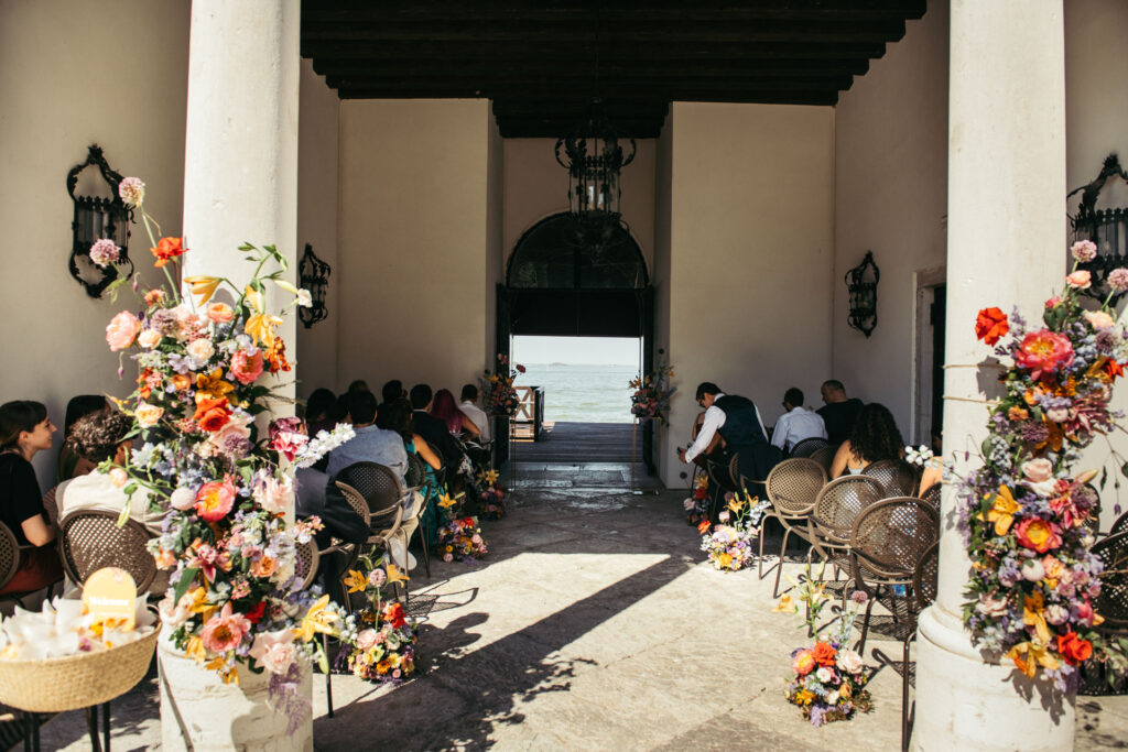 The wedding ceremony unfolds at the NH Collection Venezia Grand Hotel Palazzo dei Dogi, a venue of timeless elegance and historic charm in the heart of Venice