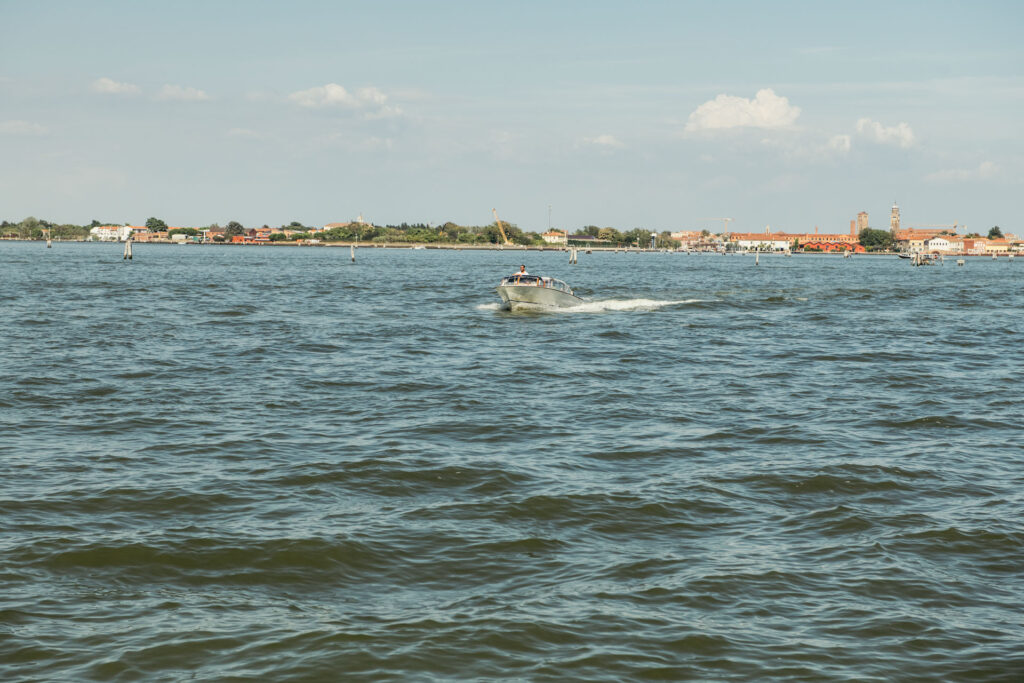 A romantic entrance as the Italo-Mexican bride and groom arrive on a water taxi, gliding through the picturesque canals of Venice towards their ceremony