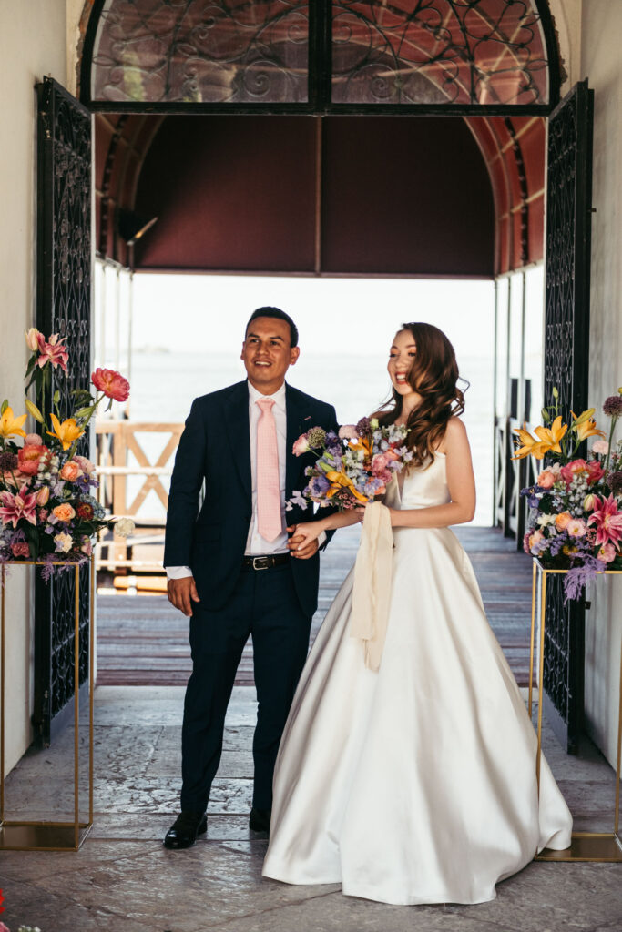 The bride and groom arrive in style at the NH Collection Venezia Grand Hotel Palazzo dei Dogi, setting the tone for an elegant and memorable wedding ceremony in Venice