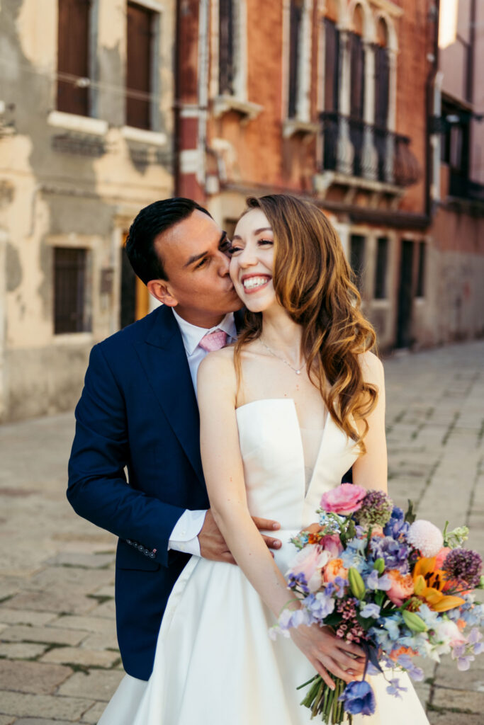 Italy Elopement: The bride and groom smile with happiness after getting married in Venice