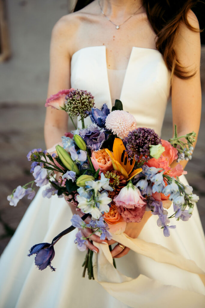 A close-up of the exquisite bouquet, capturing the vibrant colors and intricate arrangement in this enchanting and elegant wedding day portrait