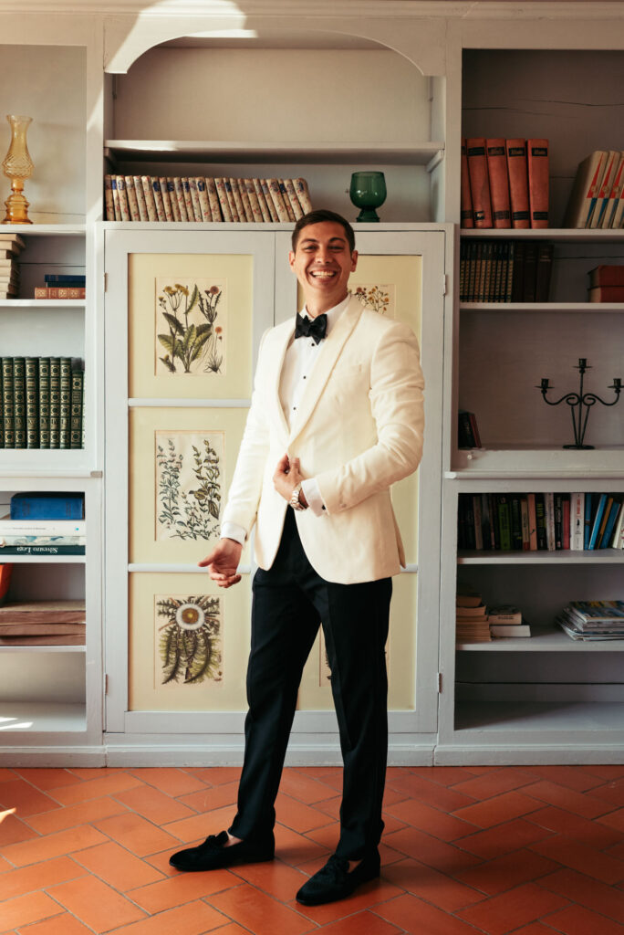 Groom is ready, wearing a white and black tux