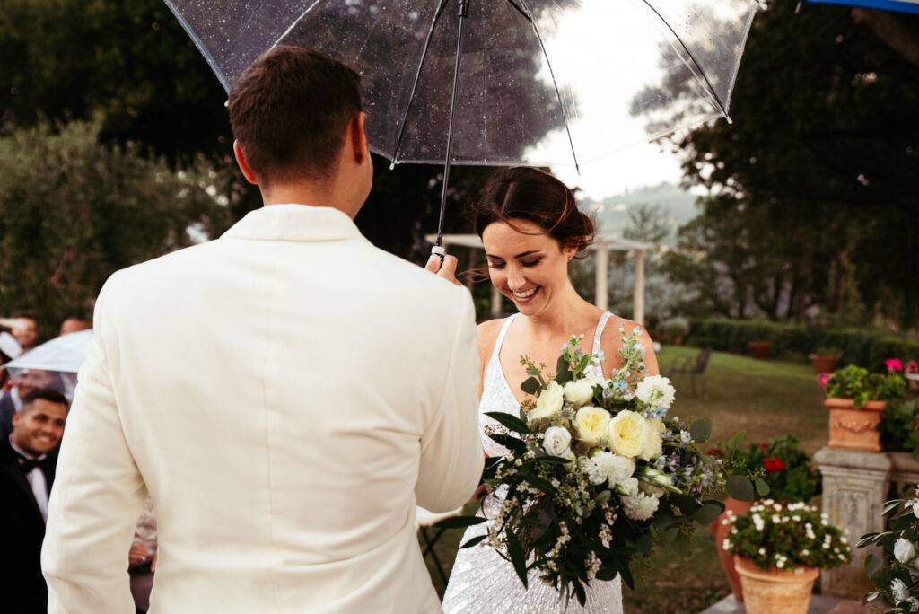 Bride and groom smile during the ceremony