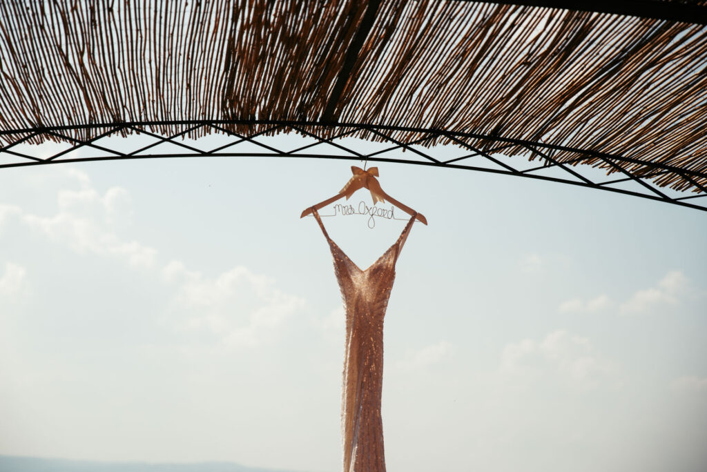 Bride's dress hanging with Tuscany hills on the background