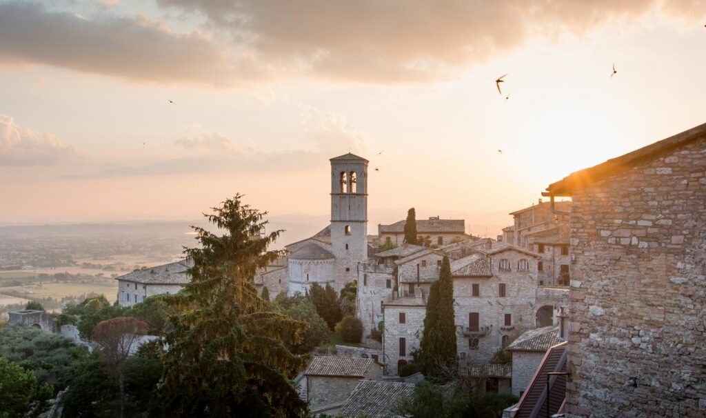 View of Umbrian village at sunset, perfect for an intimate elopement in Italy