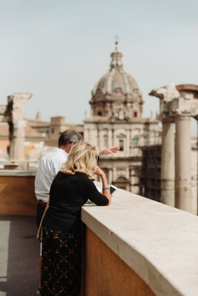 Couple admiring the Roman skyline from a rooftop, ideal for a romantic elopement in Rome