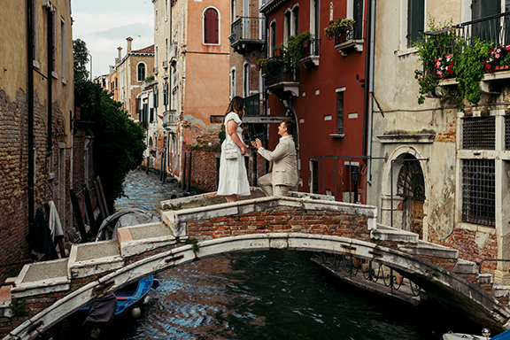 A Photoshoot Proposal in Venice on a scenic bridge in a small canal