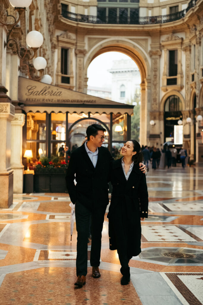 Couple walking down Galleria Vittorio Emanuele II 