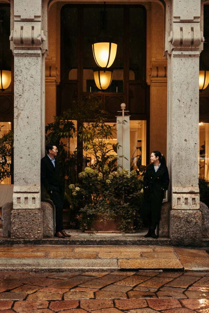 Couple looking at each other under a portico in Milan Italy