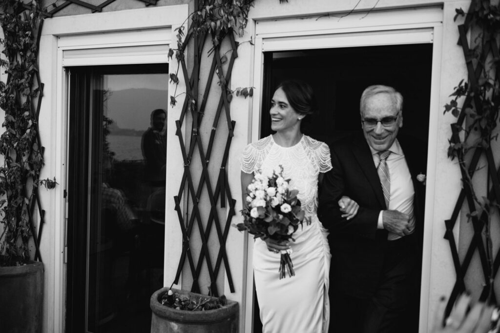 Black and white photo of bride's arrival