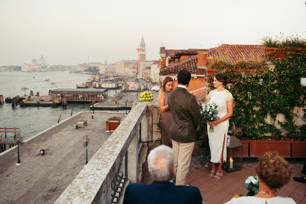 Wedding ceremony on a small terrace overlooking Venice lagoon at sunrise