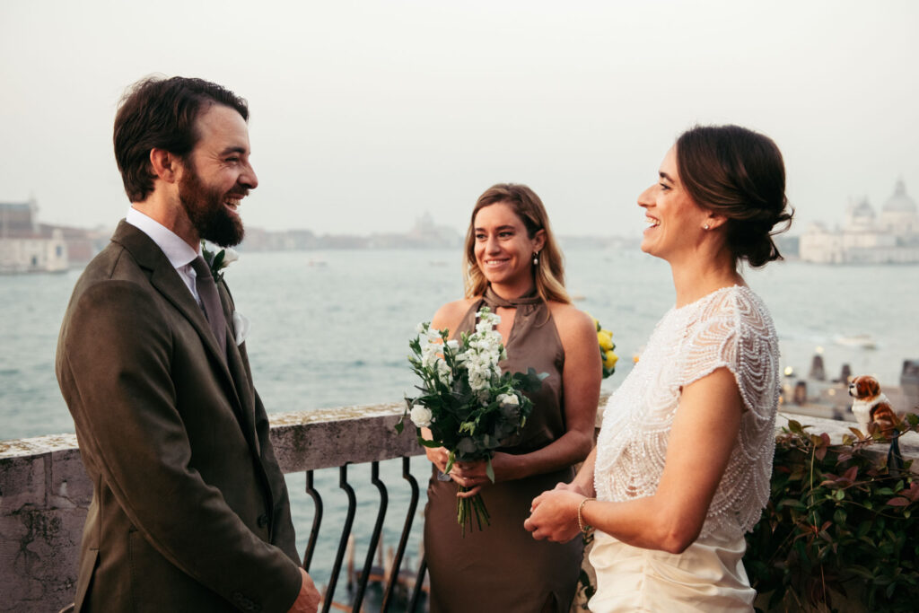 Bride and groom laughing during the symbolic ceremony