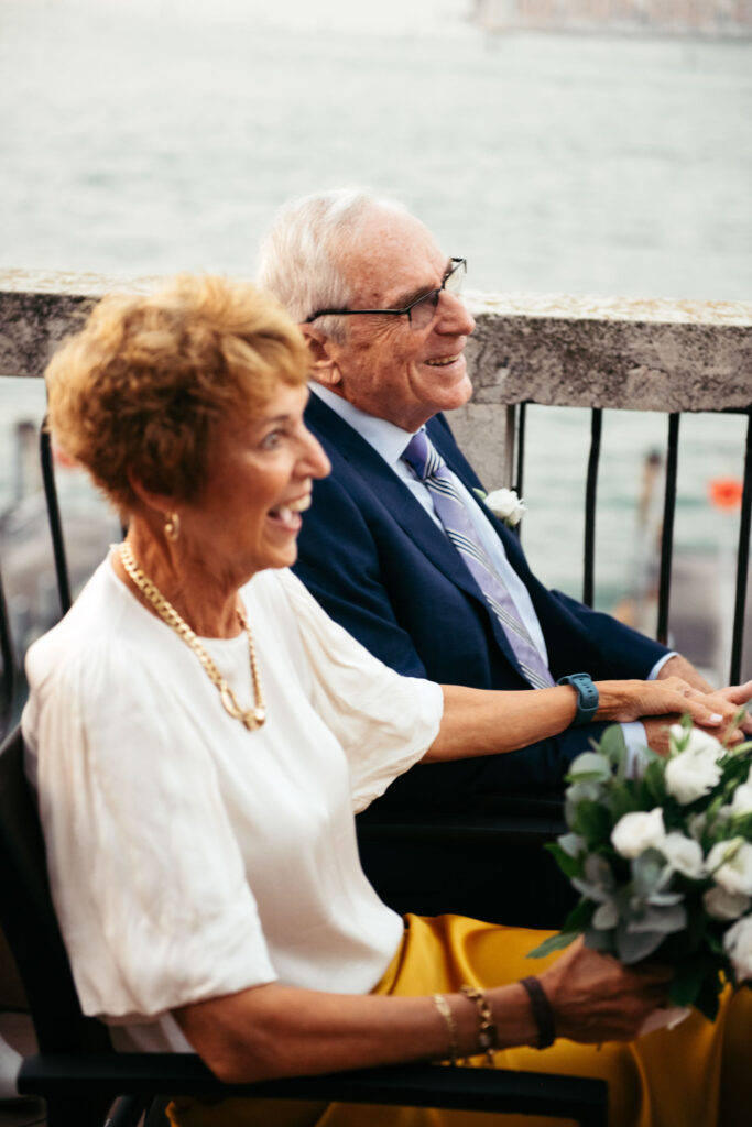 Bride's parents smile with joy