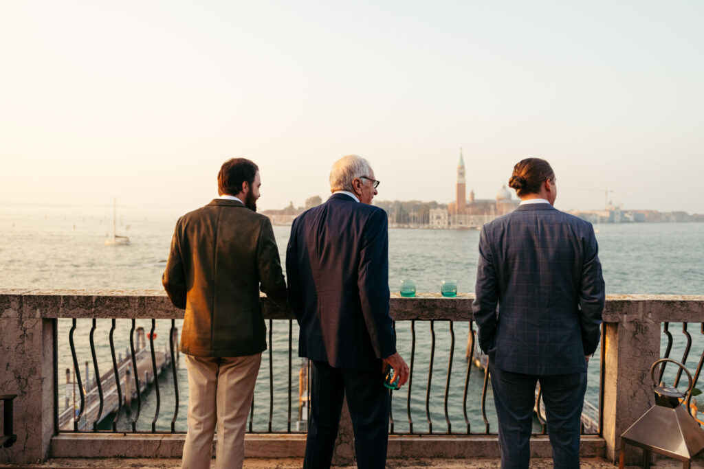 Groom, bride's father and bride's brother looking at the panoramic view