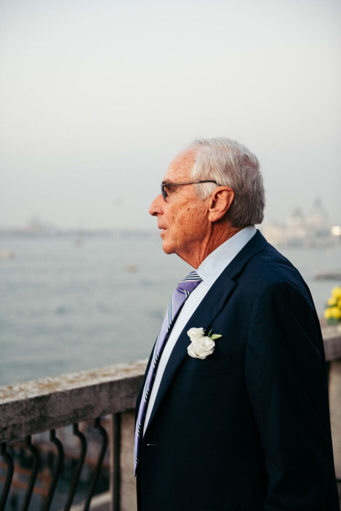 Bride's father looking at the panorama while waiting for the ceremony to start