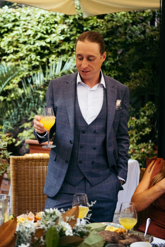 The bride's brother makes a toast and a speech