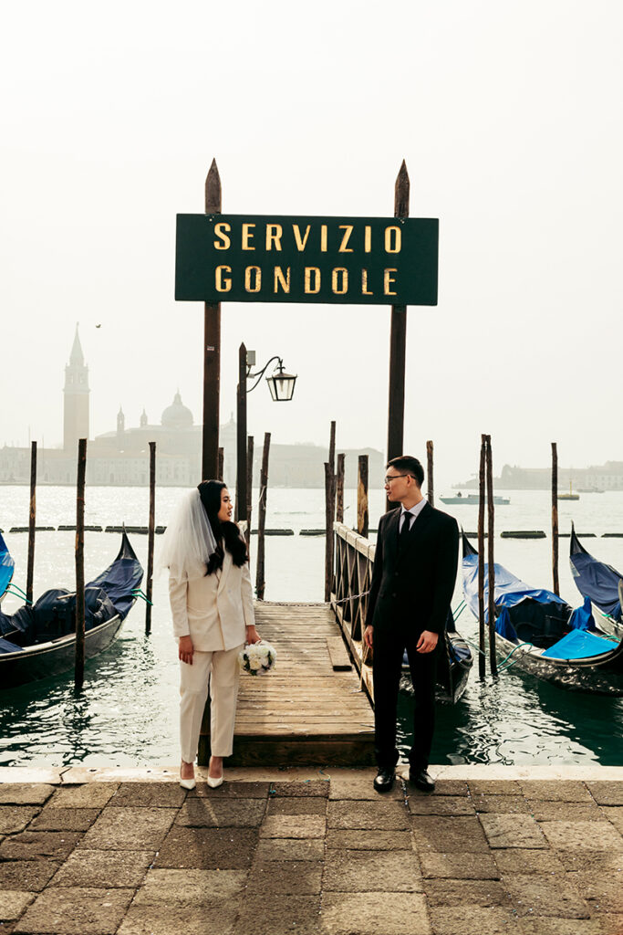 Elopement photoshoot in San Marco square in front of the gondolas