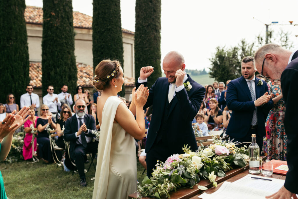 Bride and groom exchanging vows in a picturesque setting in Langhe, Piedmont