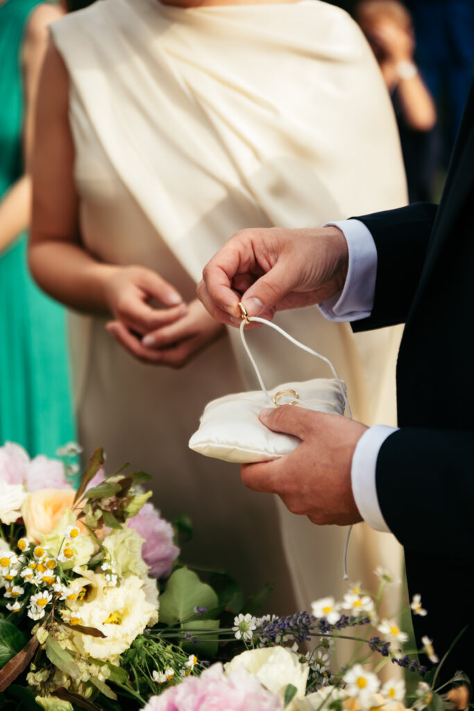 Close-up of ring exchange during the wedding ceremony in Italy