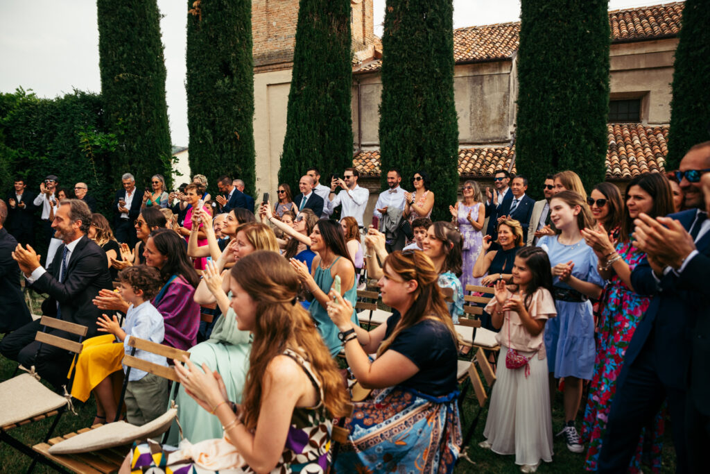 Guests cheering and applauding after the couple got married