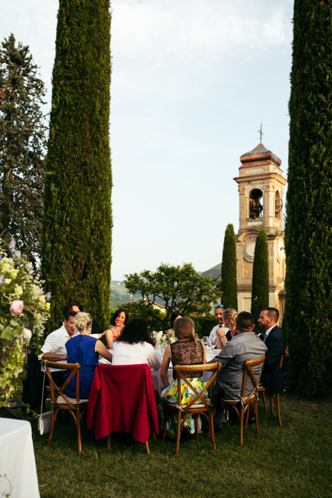 People eating local food at the wedding reception at Castello di Coazzolo