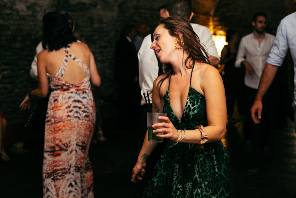 Guests dancing in the wine cellar at Castello di Coazzolo