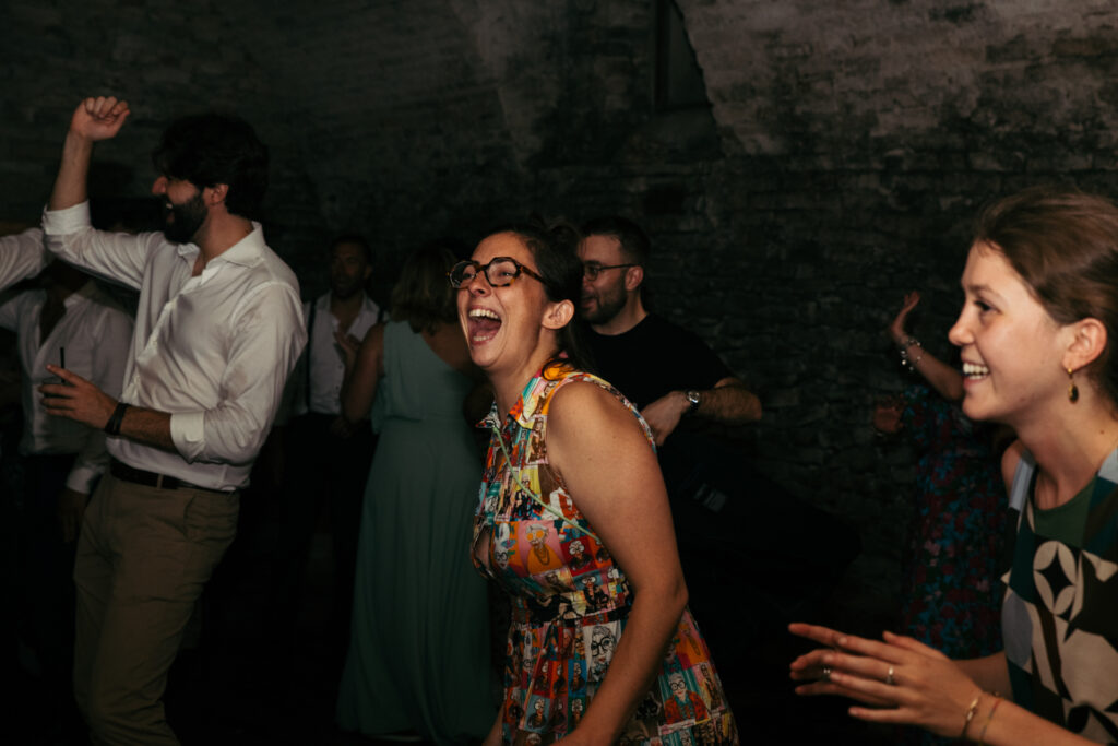 Guests partying during the wedding at Castello di Coazzolo