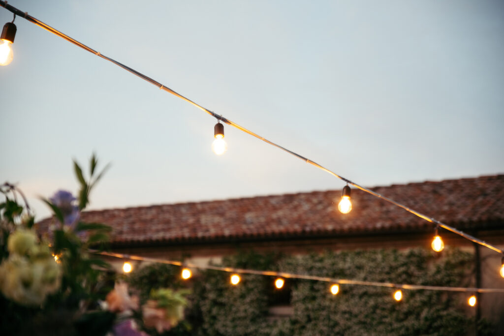 Lights at sunset during the wedding reception