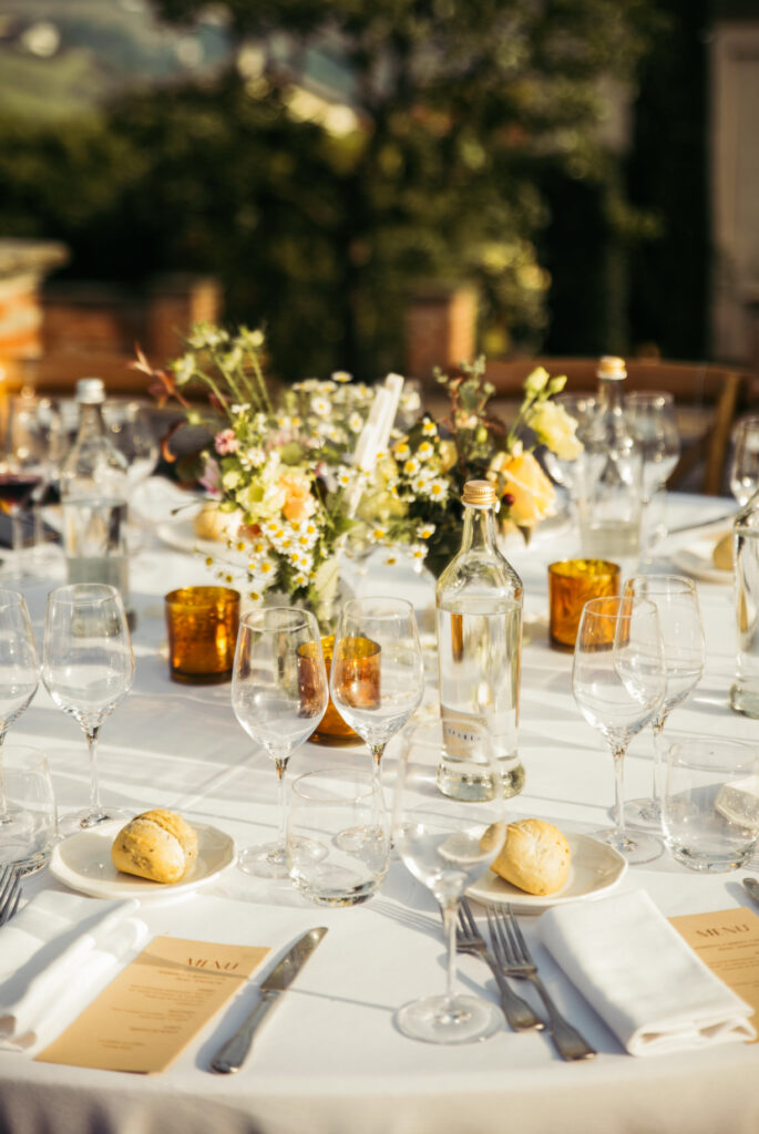 Table setup detail at sunset during the wedding reception in Piedmont Italy