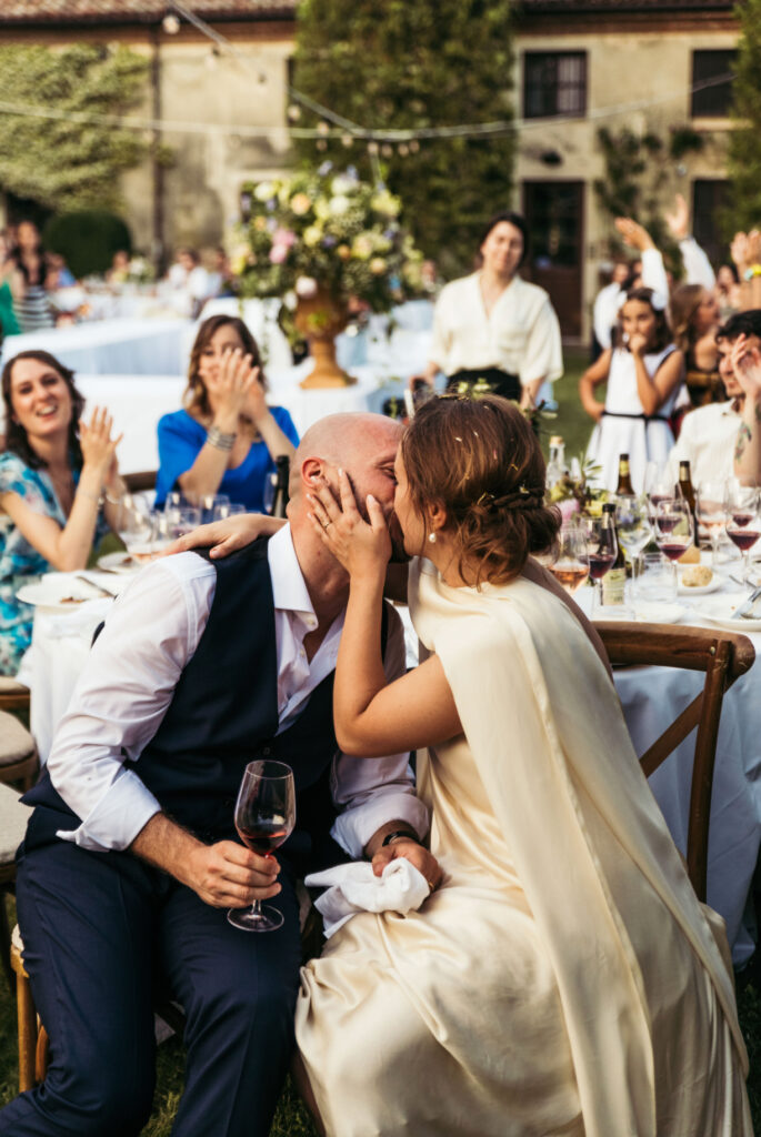 Groom and bride kiss