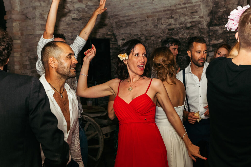 Guests partying in a wine cellar at Castello di Coazzolo