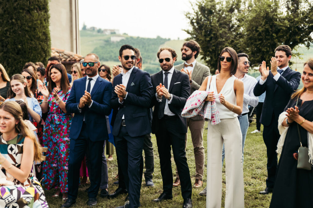 Guests attending the ceremony and applauding