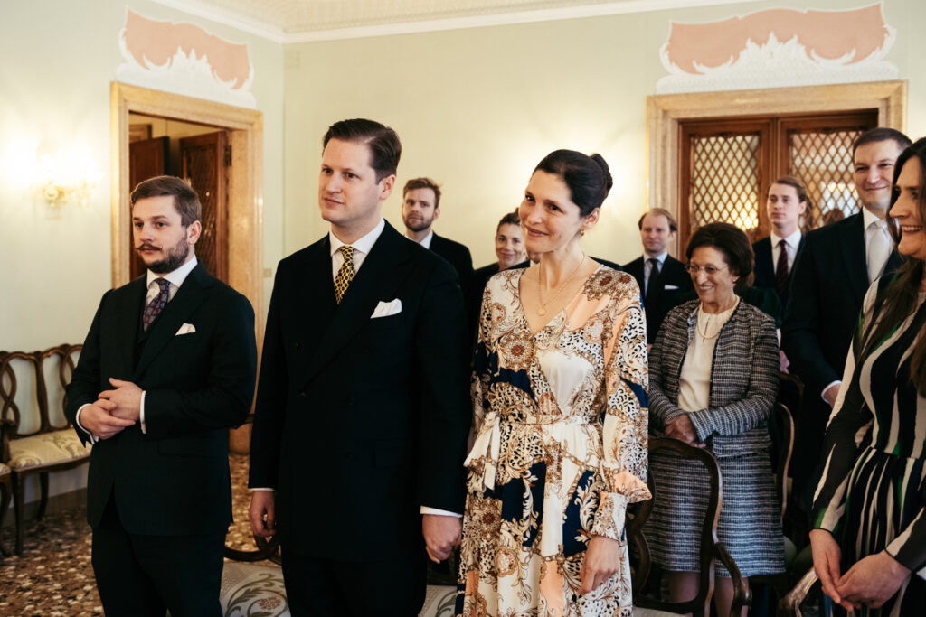 Couple at Palazzo Cavalli in Venice celebrating their micro-wedding with friends and family