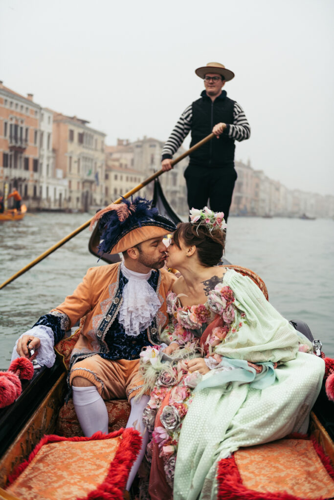 Venice Carnival couple photoshoot on a gondola ride along the Grand Canal