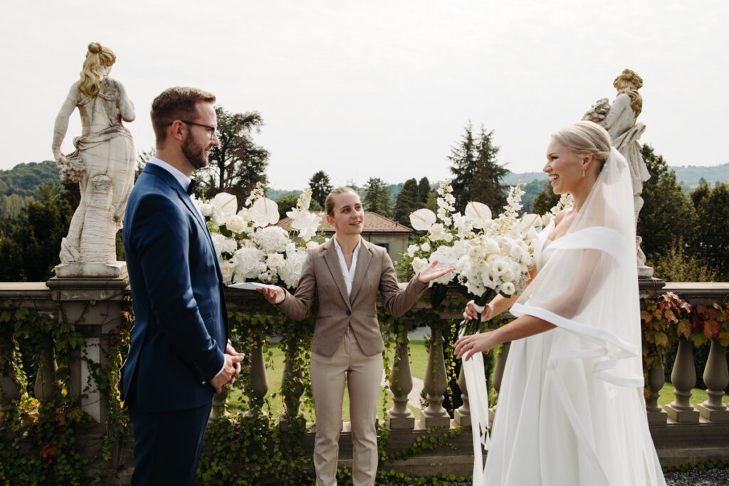 The celebrant says the couple is married as they smile and laugh