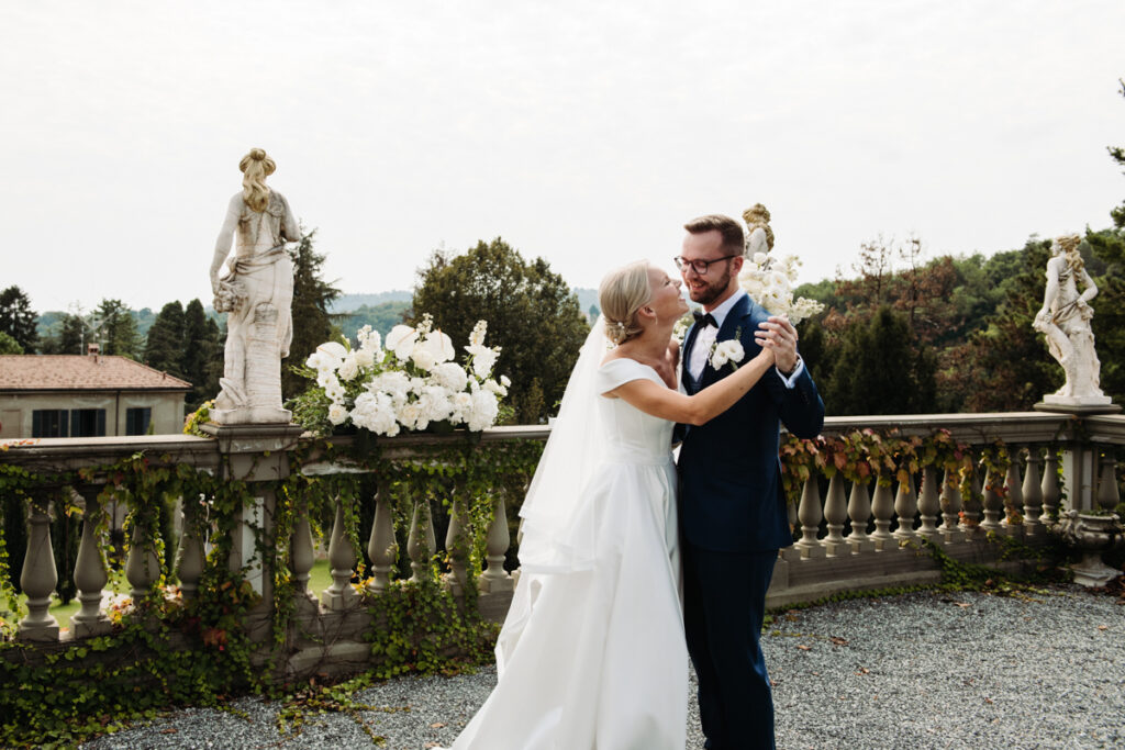 Bride and groom dancing and laughing after their symbolic ceremony at Villa Lucini