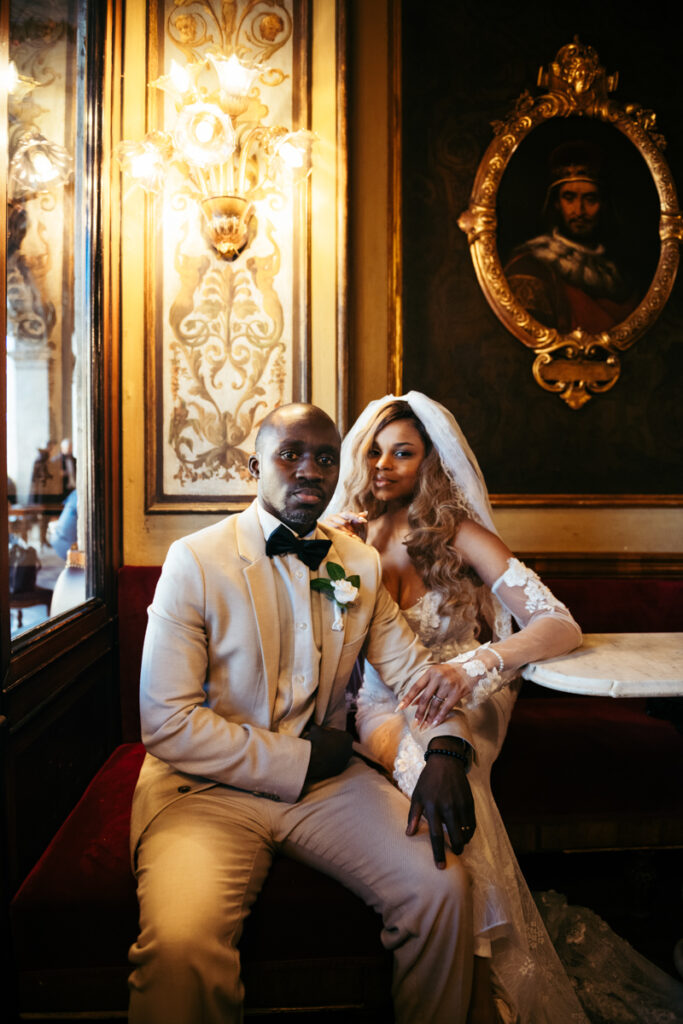 Newlyweds enjoying their time together at a romantic café in Venice.