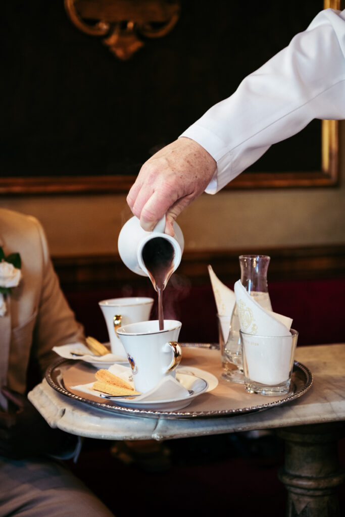 Hot chocolate being elegantly poured at Caffè Florian, Venice.