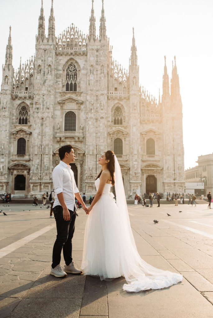 Couple photoshoot in front of Milan Cathedral at sunrise