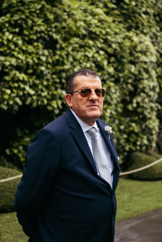 Father of the bride dressed elegantly for this Italy micro-wedding celebration.